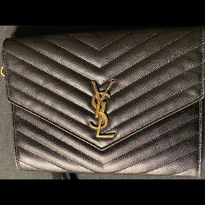 LIGHTLY USED MONOGRAM CLUTCH IN QUILTED GRAIN DE POUDRE EMBOSSED LEATHER.